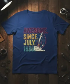 Awesome Since July 1969 text with a retro rocket launching, on a navy blue t-shirt