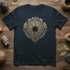 Aztec Sun Stone graphic t-shirt featuring a circular design with gold, red, and silver metallic accents in a tribal pattern
