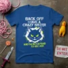 T-shirt with white text "BACK OFF I HAVE A CRAZY SISTER" above a black cat graphic and green text "AND