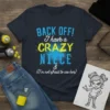 Back Off! I Have A Crazy Niece & (I'm not afraid to use her) quote on a navy t-shirt, featuring