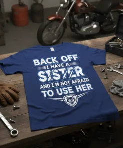 Blue t-shirt with white text "BACK OFF I HAVE A SISTER AND I'M NOT AFRAID TO USE HER" and a