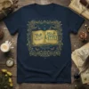 Back to the Gypsy That I Was quote on a navy t-shirt with ornate frame, open book, moon, and butterflies