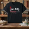 Black t-shirt with white text "BAD DAD JOKE LOADING..." and a red loading bar graphic
