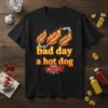 T-shirt design with text "bad day a hot dog CRASH!" and three flaming hot dogs graphic