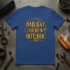 Bad Day To Be A Hot Dog text with steampunk gears graphic on a blue t-shirt