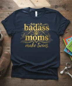 Navy t-shirt with gold foil text "badass moms make twins" and lion graphics, featuring the primary keyword