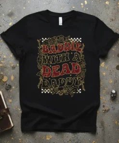 Baddie With A Dead Daddy text design on a black t-shirt with gothic floral and skull accents