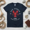 Dark navy t-shirt with a distressed red lobster graphic and text for Bar Harbor Maine Acadia National Park