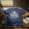 Baseball Papa t-shirt design featuring the text "BASEBALL PAPA" with a baseball, bat, and stars