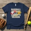 Baseball Softball Is My Favorite Season text design with baseball and softball graphics on a navy t-shirt
