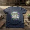 BASIC HUMAN RIGHTS ARE NOT RADICAL text with floral and geometric design on a navy t-shirt