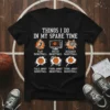 Black t-shirt with "Things I Do In My Spare Time" text and basketball-related graphics, including playing, watching, researching, and thinking