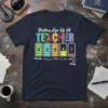 Battery Life Of A TEACHER T-Shirt design with colorful text and battery icons showing energy levels from Tuesday to Friday