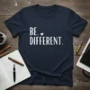 Navy blue t-shirt with white text "BE. ♡ DIFFERENT." featuring a small heart symbol