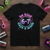 Black t-shirt with "be kind 6-7 days a week" text in a circular gradient design