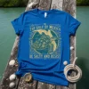 Blue t-shirt with "The Gulf of Mexico Estd 1550 Be Salty And Resist" text, sea turtle, and map graphic
