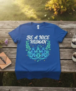Blue t-shirt with "BE A NICE HUMAN" text in white, surrounded by green leaves and figures holding hands