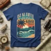 Beautiful Island Hawaii graphic tee with a palm tree, ocean waves, and mountains at sunset