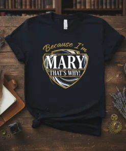 Black t-shirt with gold and white text reading "Because I'm Mary That's Why!" in a shield design