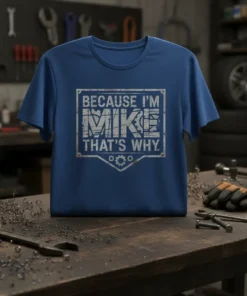 Because I'm Mike That's Why quote on a blue t-shirt, featuring distressed typography and gear graphics