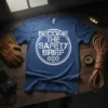 Blue t-shirt with white distressed text "BECOME THE SAFETY BRIEF" inside a rope circle, featuring gears at the bottom