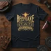 Beefcake Prime Cut Athletics T-Shirt with bull skull graphic and muscular figures, gold text on navy