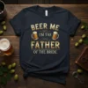 Beer Me I'm The Father Of The Bride text with beer mug graphics on a navy t-shirt