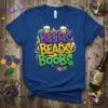 BEERS BEADS BOOBS text design with Mardi Gras masks and beer mugs, printed on a royal blue t-shirt