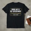 Being Shy Is My Superpower The Quiet Strength quote on a black t-shirt, white and gold text, graphic design