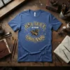 Believe In Your Dreams t-shirt with a golden flying pig graphic and ornate typography