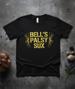 Black t-shirt with yellow "Bell's Palsy Sux" text and decorative branches, promoting awareness