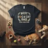 Black t-shirt with "BEST DOG & CAT DAD EVER EVER EVER" text, featuring paw print and laurel wreath graphic