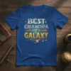 Best Grandpa in the Galaxy text with planets and stars graphic on a blue t-shirt