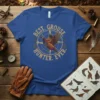 Best Grouse Hunter Ever text with a compass and pheasant graphic on a blue t-shirt for hunters