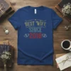 Blue t-shirt with distressed text "BEST WIFE SINCE 2018" and heart graphics, celebrating marriage anniversary