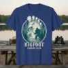 Bigfoot Fishing Club t-shirt design showing Bigfoot fishing next to a large bass, within a footprint graphic