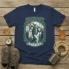 Bigfoot Hunter t-shirt design with Bigfoot carrying a deer and rifle, surrounded by a forest wreath