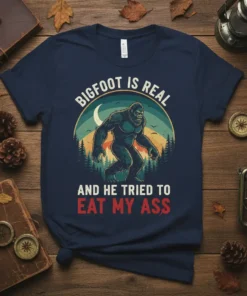 Bigfoot Is Real And He Tried To Eat My Ass quote on a navy t-shirt with a vintage Bigfoot graphic