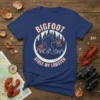 Bigfoot Stole My Lobster t-shirt design with Bigfoot holding lobsters in a forest circle