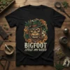 Bigfoot Stole My Weed t-shirt design with a cartoon Bigfoot wearing a hat and smoking a pipe surrounded by cannabis
