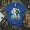 Bigfoot's Walking Partner t-shirt design featuring Bigfoot walking a beagle in a forest setting