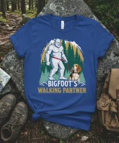 Bigfoot's Walking Partner t-shirt design featuring Bigfoot walking a beagle in a forest setting