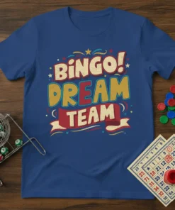 Blue t-shirt with "BINGO! DREAM TEAM" text in colorful, distressed typography. Features stars and ribbons, evoking a fun bingo theme