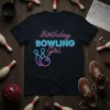 Birthday Bowling Girl text design with bowling pins and ball graphic, neon pink and blue colors, on a black t-shirt