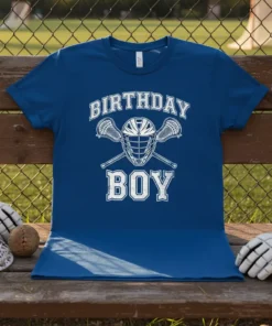 Birthday Boy lacrosse t-shirt with helmet and crossed sticks graphic in white on a royal blue shirt