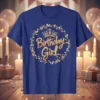 Birthday Girl T-Shirt with gold glitter text, crown, and leafy wreath design
