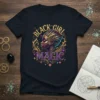 Black Girl Magic text with an Afrocentric woman's profile and ornate gold details, on a black t-shirt