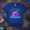 Blast Off Into Fifth Grade! text with a retro rocket ship launching through a sunset graphic on a blue t-shirt