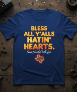 Navy blue t-shirt with bold yellow and orange text: "Bless All Y'alls Hatin' Hearts. From Houston With Love." and a