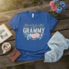 Blessed to be called GRAMMY text with pink and blue floral accents on a royal blue t-shirt